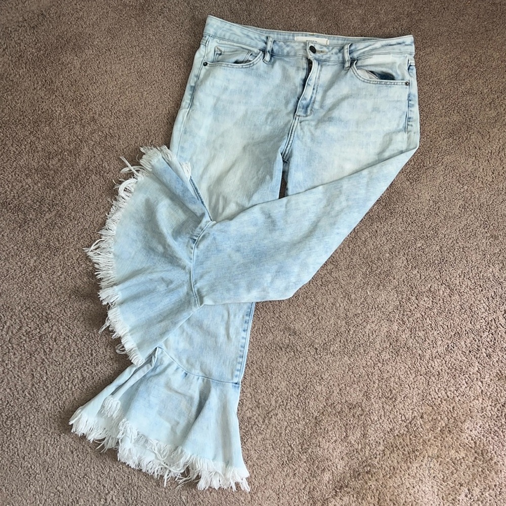 Hidden brand flair ruffle jeans